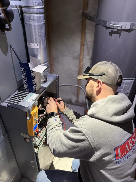 Technician repairing HVAC equipment